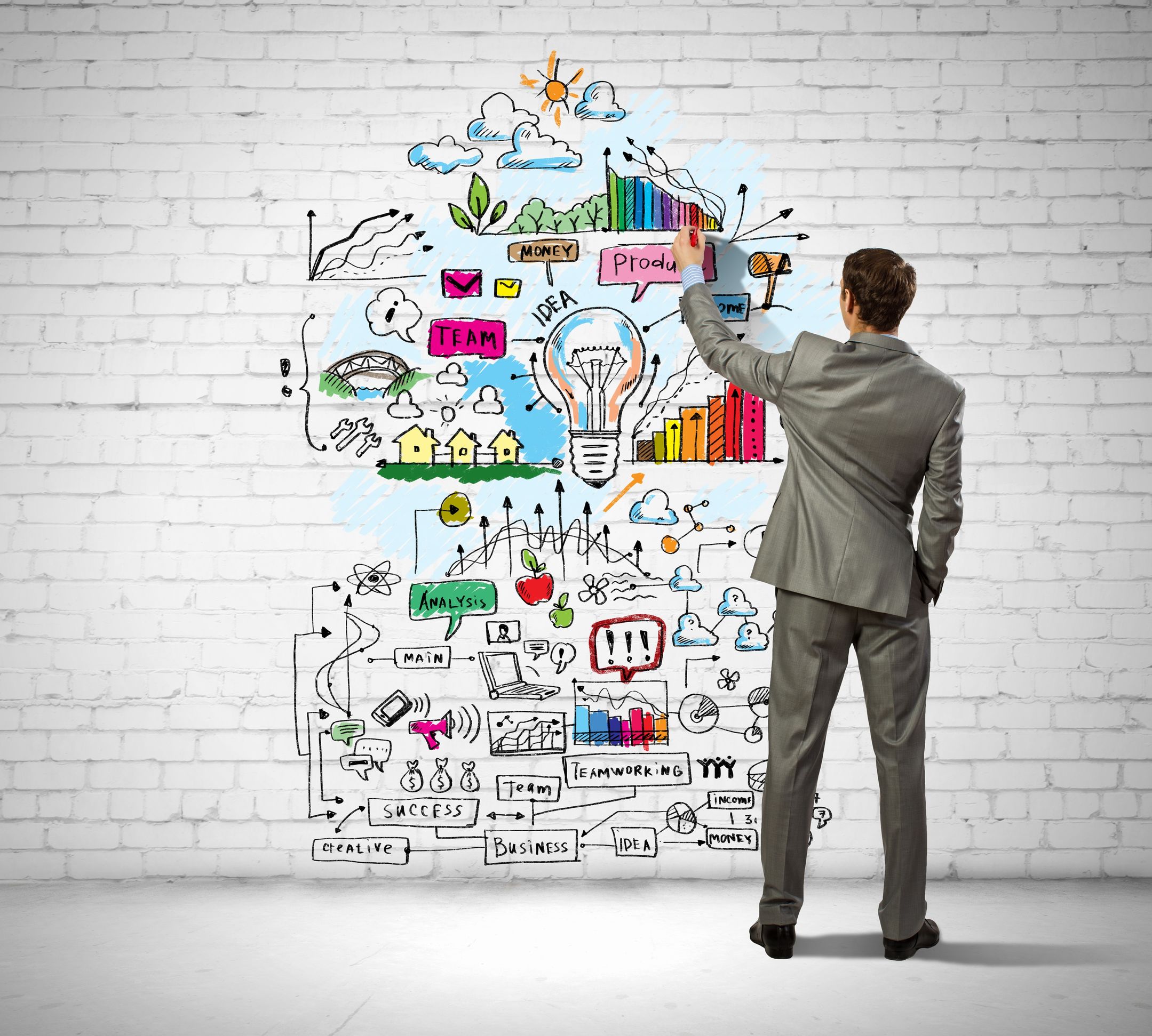 21247179 - back view image of businessman drawing sketches on wall